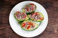 Avocado boats stuffed with tuna, red onion and cherry tomatoes.