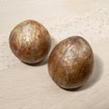 Avocado bone on a wooden board.