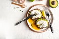 Avocado and cheese toast with poached eggs. Delicious breakfast or snack on a light background, top view Royalty Free Stock Photo