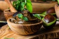 Avocado chocolate mousse in olive wooden bowl Royalty Free Stock Photo
