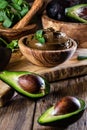 Avocado chocolate mousse in olive wooden bowl Royalty Free Stock Photo