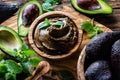 Avocado chocolate mousse in olive wooden bowl