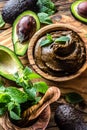 Avocado chocolate mousse in olive wooden bowl Royalty Free Stock Photo