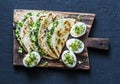 Avocado cream cheese micro greens quesadilla and boiled eggs on cutting board on a dark background, top view. Delicious healthy Royalty Free Stock Photo