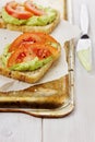 Avocado cream with toasts and tomatoes