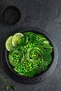 avocado, cucumber, broccoli, asparagus and sweet peas salad, fresh green vegan detox lunch bowl Royalty Free Stock Photo