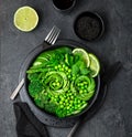 avocado, cucumber, broccoli, asparagus and sweet peas salad, fresh green vegan detox lunch bowl Royalty Free Stock Photo