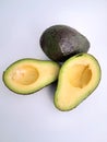Avocado cut in half on a white background Royalty Free Stock Photo