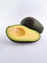 Avocado cut in half on a white background Royalty Free Stock Photo