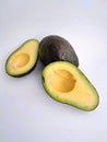 Avocado cut in half on a white background Royalty Free Stock Photo
