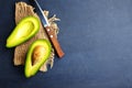 Avocado on dark table. fresh avocado, halfs of avocado