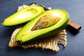 Avocado on dark table. fresh avocado, halfs of avocado