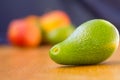 Avocado fuerte with fruits on the background