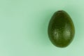 Avocado on green background