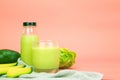 Avocado and green cos salad blended in a glass and bottle, healthy drinking water. horizontal photo Royalty Free Stock Photo