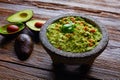 Avocado Guacamole on molcajete real Mexican Royalty Free Stock Photo