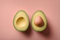 Avocado halves with egg on pink background. Minimal food concept.