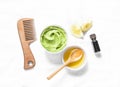 Avocado, honey hair homemade mask on light background, top view. Natural products for hair health