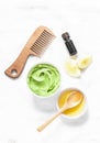 Avocado, honey hair homemade mask on light background, top view. Natural products for hair health