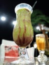 Avocado juice that I ordered at a cafe located on the coast of Marina beach Royalty Free Stock Photo