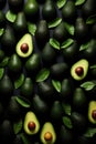 Avocado with leaves on black background. Top view. Flat lay. Royalty Free Stock Photo