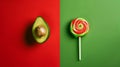 Avocado and lollipop on a red and green split background. Healthy versus junk food. Diet concept. Generative AI Royalty Free Stock Photo