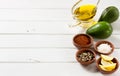 Avocado and other ingredients for sauce guacamole on the table. Royalty Free Stock Photo