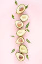 Avocado on pink background. Tropical abstract background with avocado. Food concept. flat lay, top view