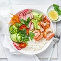 Avocado, prawn, cucumber, tomato, radish, carrot and rice salad bowl. Healthy food