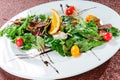 Yellow tomato, cucumber, red cabbage and watermelon radish vegetables salad. healthy raw vegan lunch bowl. Top view Royalty Free Stock Photo