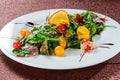 Yellow tomato, cucumber, red cabbage and watermelon radish vegetables salad. healthy raw vegan lunch bowl. Top view Royalty Free Stock Photo