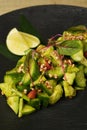 Avocado salad with fresh cucumber almond, close-up