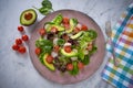 Avocado salad with sprouts tomatoes spinach