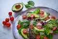 Avocado salad with sprouts tomatoes spinach