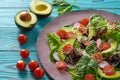 Avocado salad with sprouts tomatoes spinach