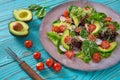 Avocado salad with sprouts tomatoes spinach