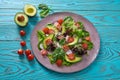 Avocado salad with sprouts tomatoes spinach