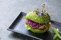 Avocado burger with green patty