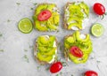 Avocado sandwich, healthy food appetizer toast tomato savory dinner on concrete background