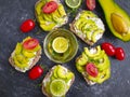 Avocado sandwich, tomato recipe on concrete background homemade