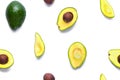 Avocado seamless pattern. Background made from isolated avocado pieces on white background. Flat lay of whole and half avocados, Royalty Free Stock Photo