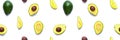 Avocado seamless pattern. Background made from isolated avocado pieces on white background. Flat lay of whole and half avocados, Royalty Free Stock Photo