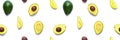 Avocado seamless pattern. Background made from isolated avocado pieces on white background.  Flat lay of whole and half avocados, Royalty Free Stock Photo