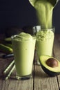 Avocado Shake or Smoothie Being Poured Into Glasses Royalty Free Stock Photo