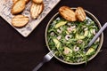 Avocado, Shrimp and Arugula Salad in a plate and toasts grill