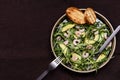 Avocado, Shrimp and Arugula Salad in a plate and toasts grill