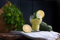 Avocado smoothie and lime in a glass. Food for health and beauty. Super food from vegetables and fruits. Wooden background, free