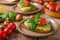 Avocado spread bread with baked tomato