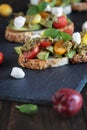 Avocado Toast with Basil Tomatoes Mozzarella Cheese and Pesto Royalty Free Stock Photo