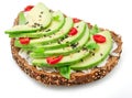 Avocado toast - bread with avocado slices, pieces of chilli pepper and black sesame isolated on white background Royalty Free Stock Photo